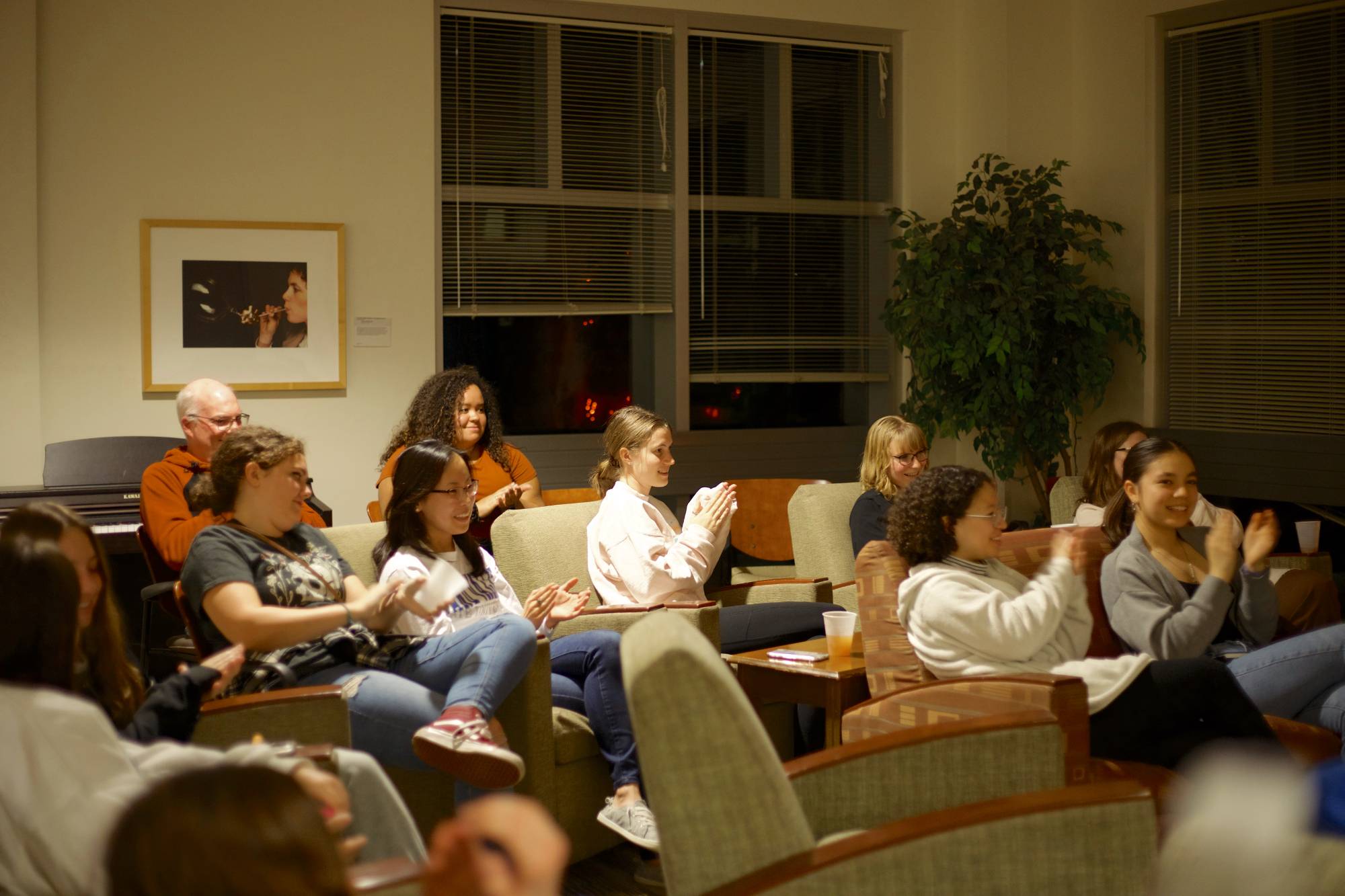 Students applauding the ghost story presenter